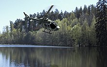 Helicopter following a river to enable low level flight Pilot, safety director, bishop, Jangro retiring after 42 years 140919-A-ZZ999-830.jpg