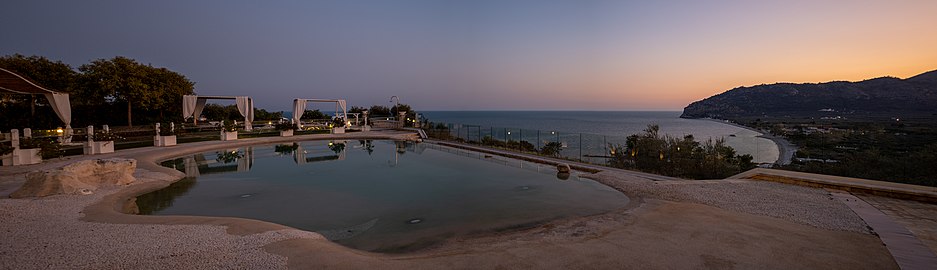 Pool of the Holiday Lodge al Porto at sunset, Mattinata, Italy