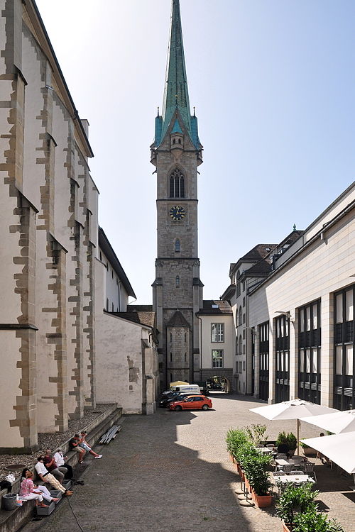 Predigerkirche to the left, the adjoint Zentralbibliothek to the right, the 96 metres (315 ft) high church tower in the middle