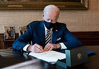 President Biden signs H.R. 335 into law, thus allowing Lloyd Austin to become Secretary of Defense. President Joe Biden signs H.R. 335.jpg