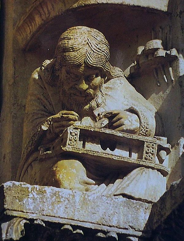 Philosopher on one of the archivolts over the right door of the west portal at Chartres Cathedral