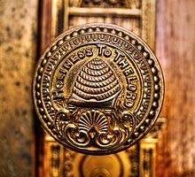 A doorknob of the Salt Lake Temple bearing an image of a beehive and carrying the inscription, "Holiness to the Lord" SL Temple doornob.jpg