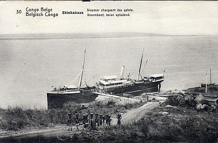 A steam boat arriving at Boma on the Congo River in 1912