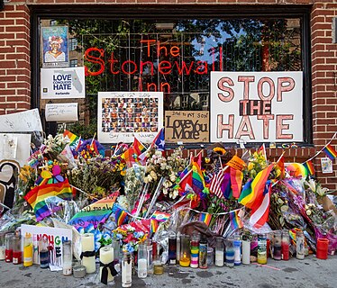 Pulse nightclub shooting memorial in front of the Stonewall Inn during Pride 2016