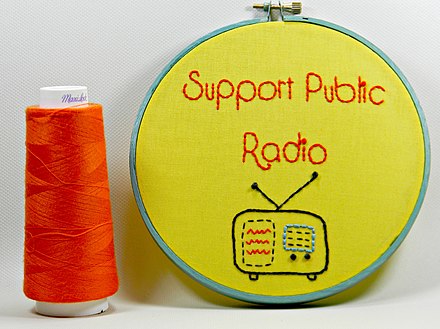 A homemade artwork references the importance of public funding for National Public Radio