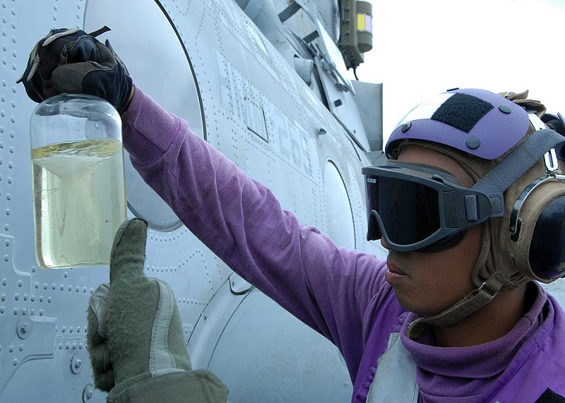 File:U.S. Navy Aviation Boatswain's Mate Airman Norberto Riegodedios examines a fuel sample before refueling a Marine Corps CH-46E Sea Knight helicopter assigned to Marine Medium Helicopter Squadron (HMM) 265 Oct. 9 111009-N-PV215-056.jpg