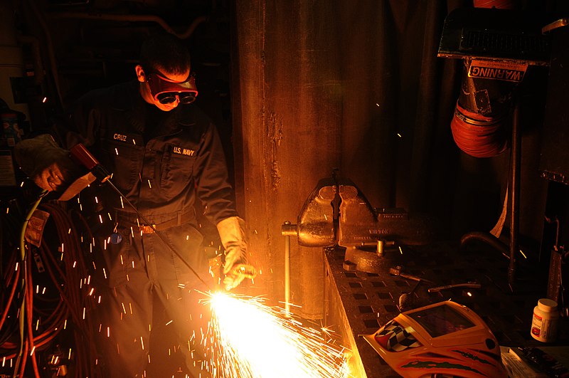 File:US Navy 110208-N-5324W-059 Damage Controlman Fireman Apprentice Larry Cruz demonstrates using a Portable Exothermic Cutting Unit aboard the guided.jpg