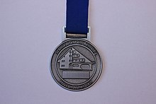 Front medal of the 44th GutsMuths-Rennsteiglauf Half Marathon 2016.jpg