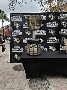 The UCF/Orlando side of the football trophy War on I-4 Trophy at the UCF National Champs Block Party (27818915499).jpg