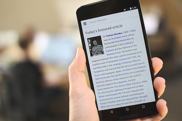 A smartphone displaying the homepage of the English Wikipedia