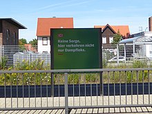 'Keine Sorge - hier verkehren nicht nur Dampfloks' - Deutsche Bahn sign on Wernigerode Hauptbahnhof main line platform 'Keine Sorge - hier verkehren nicht nur Dampfloks' - Deutsche Bahn sign on Wernigerode Hauptbahnhof main line platform.jpg