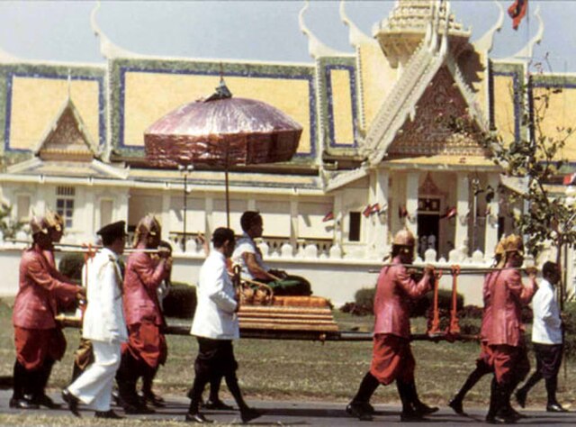 Queen Kossamak on a palanquin in the inner court, behind is the Khemarin Palace