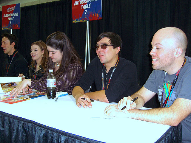 The Funimation staff and voice cast of the anime at the 2011 New York Comic Con, from left to right: Todd Haberkorn (Natsu), Cherami Leigh (Lucy), Col