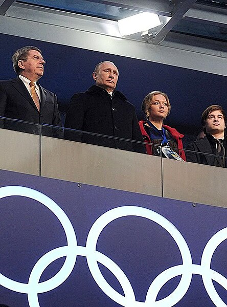 Thomas Bach, President Vladimir Putin and bobsledder Irina Skvortsova at the opening ceremony