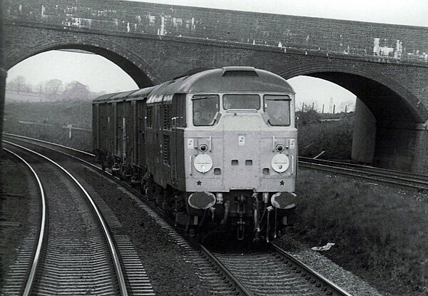 Class 31/1 on Sharnbrook bank with a short van train in April 1985