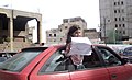 A Benghazi girl holding a paper.jpg