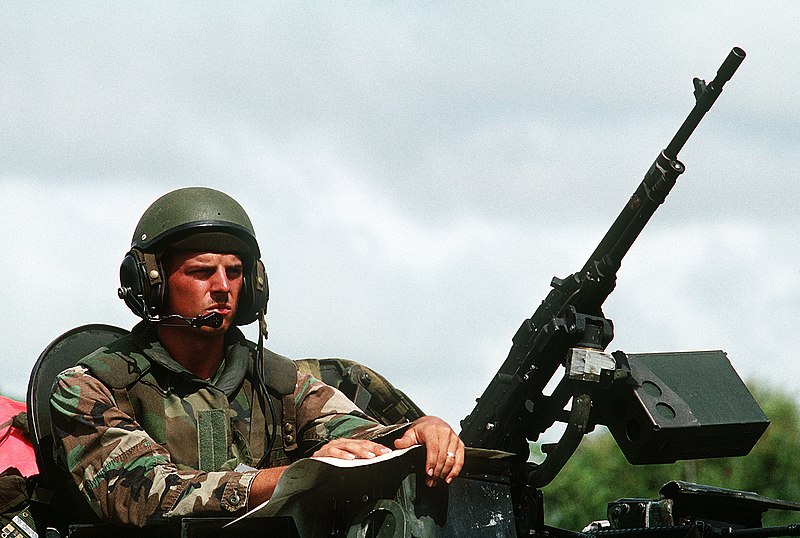 File:A Marine crewman aboard a LAV-25 Light Armored Vehicle (LAV) consults a map during a patrol between Rodman Naval Station and Howard Air Force Base. The patrol, made up of ten LAVs a - DPLA - 213a44b7d38bf1605c38452c28b53818.jpeg