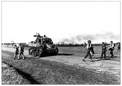 Troops and tank of the 7th Infantry, 3d Infantry Division, inland of Fedala. (National Archives)