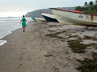 Working coast: The beaches are the hub of economic activity in Alligator Pond. The bauxite exporting Port Kaiser is visible on the horizon. Alligator pond Jamaica fishing boats gm.jpg