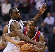 Turner with the 76ers against Gilbert Arenas Arenas guarding Evan Turner.jpg