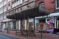 Deutsch: Straßenbahn- und Bushaltestelle Leinaustraße, von Andreas Brandolini gestaltet im Rahmen des Kunstprojektes BUSSTOPS, in der Limmerstraße Höhe Leinaustraße im Stadtteil Linden-Nord von Hannover. English: Bus and tram station Leinaustrasse, designed by Andreas Brandolini as part of the BUSSTOPS art project. The station is located at Limmerstrasse / Leinaustrasse in Linden-Nord quarter of Hannover, Germany.