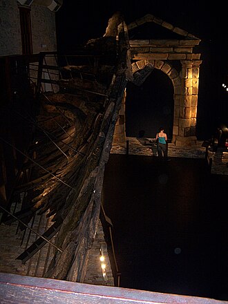 Batavia's hull remains and a replica of the portico on display in the Fremantle Shipwreck Gallery, WA Batavia 01 gnangarra.jpg