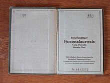 West Berlin auxiliary identity card, bearing the words "The holder of this identity card is a German national" in German, French and English Behelfsmassiger Personalausweis.JPG