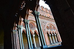 One of the two four-light windows of the south-eastern loggia restored to its original shape; on the background, the four-light windows of the south-western side Castello Visconteo 13.JPG