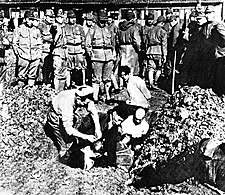 Japanese soldiers bury Chinese civilian prisoners alive during the Nanjing Massacre
