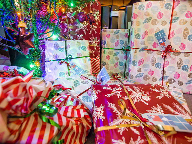 By James Petts from London, England (Christmas presents under the tree) [CC BY-SA 2.0], via Wikimedia Commons