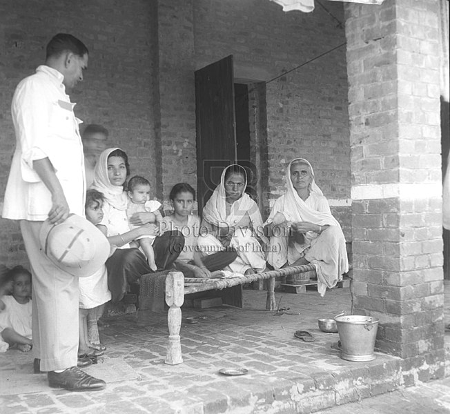 File:Col. Rai talking to refugees at Kingsway Camp.jpg