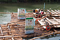 * Nomination: Detail of a (timber) raft on the river Isar. Here you can see four different rafts which are bound together for loading the passangers. On the rear side (front side of the picture) you can see two toilets and the superstructure with the benches for the people and the musicians. --Mummelgrummel 07:27, 31 July 2015 (UTC) * * Review needed