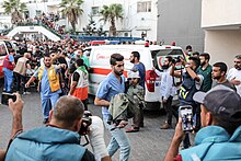 Injured child being carried into Al-Shifa Hospital in October 2023 Damage in Gaza Strip during the October 2023 - 40.jpg