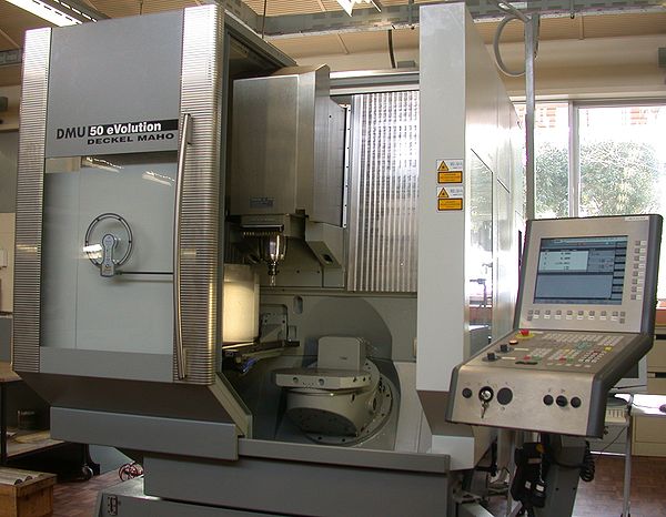 Five-axis machining center with rotating table and computer interface