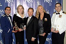 Department of Defense staff holding the Silver Anvil award in 2008 DoD staff hold media awards in 2008.JPG