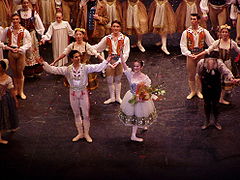 Elena Glurdjidze as Swanilda & Aroniel Vargas as Franz in the English National Ballet's production of Coppelia. Southampton's Mayflower Theatre. Also in the picture (bowing) is Michael Coleman as Dr. Coppelius. English National Ballet.jpg