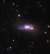 Плава компактна патуљаста галаксија ESO 338-4.[12]