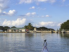 Flamingo Marina from the Florida Bay entrance. Salt/fresh water dam, kayak launch pad, slips, and ranger boats are visible.