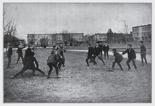 School kids while playing a game of tag. Photo from 1909. Game of Tag (1909).png