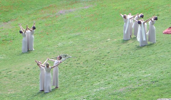 The ceremony for the lighting of the flame was arranged as a pagan pageant, with dancing priestesses.