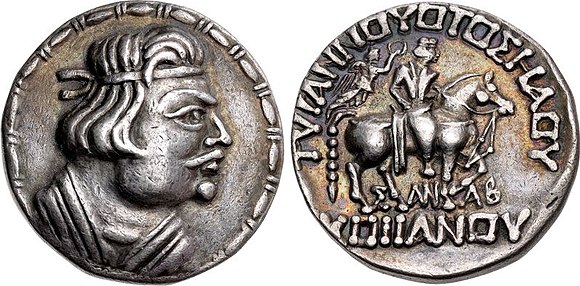 The first self-declared Kushan ruler Heraios (1–30 AD) in Greco-Bactrian styleObv: Bust of Heraios, with Greek royal headband.Rev: Horse-mounted King, crowned with a wreath by the Greek goddess of victory Nike. Greek legend: TVPANNOVOTOΣ HΛOV – ΣΛNΛB – KOÞÞANOY "The Tyrant Heraios, Sanav (meaning unknown), of the Kushans"