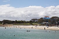Beach and waterslides of The Great Escape visible in the background in 2015, prior to demolition. Hillarys Boat Harbour Beach.jpg