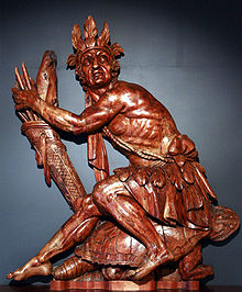 19th-century ship decoration of an Iroquois warrior sitting on a turtle, referencing the Great Turtle that carries the Earth in Iroquois mythology. Made in the sculpture workshop of the naval arsenal in Brest, France. Iroquois Indian-Poop decoration mg 8118.jpg