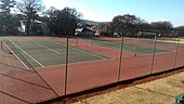 Tennis courts on the far left of the bottom grounds Jeppe Girls tennis court 2.jpg