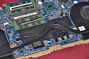 Typical heat pipe configuration within a consumer laptop. The heat pipes conduct waste heat away from the CPU, GPU and voltage regulators, transferring it to a heatsink coupled with a cooling fan that acts as a fluid-to-fluid heat exchanger. Laptop Heatpipe.jpg