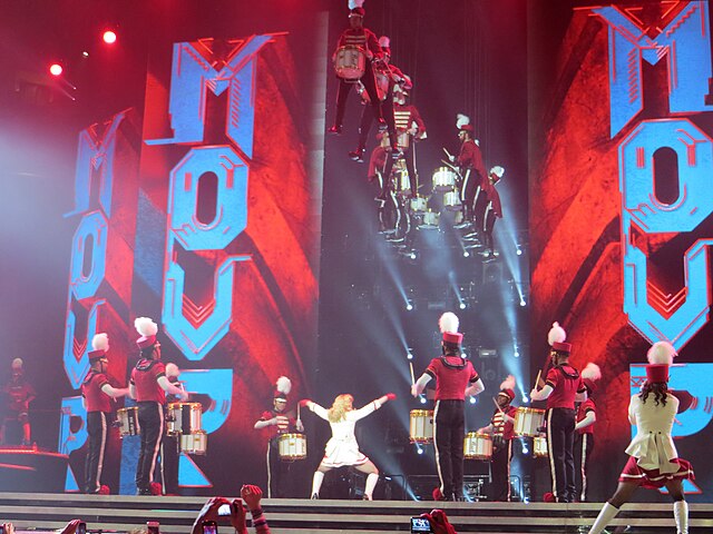 The performance of lead single "Give Me All Your Luvin'" during the MDNA Tour, which went on to become one of the highest-grossing concert tours of al