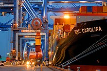 Container ships are used by shipping lines to transport cargo. MSC Carolina docked at Port of New Orleans.jpg