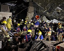 Over a dozen emergency workers comb through the rubble of Plaza Towers Elementary School. May 20, 2013 Moore, Oklahoma tornado search and rescue.jpg