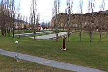 Auguste Piccard Space in Sierre with a circle of trees above the tunnel. Memorial-Sierre-13-03-2012-3.jpg