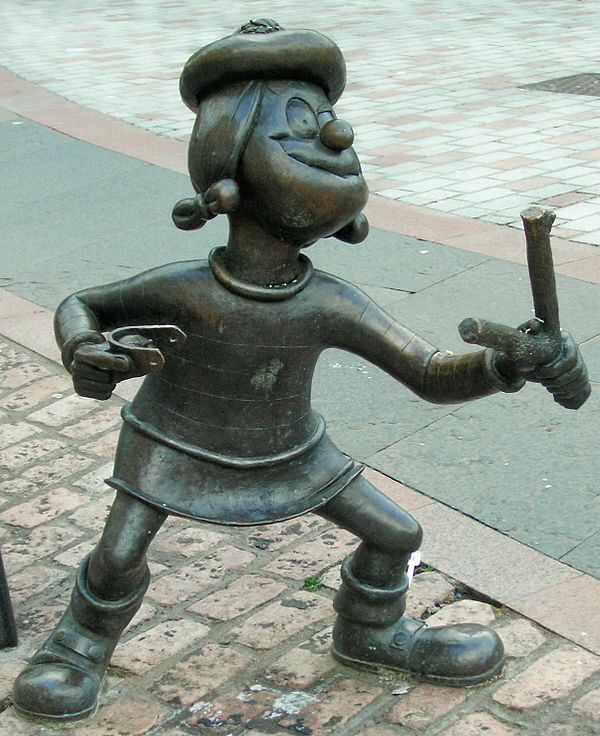 Statue of Minnie the Minx, a character from The Beano, in Dundee, Scotland. Launched in 1938, The Beano is known for its anarchic humour, with Dennis 